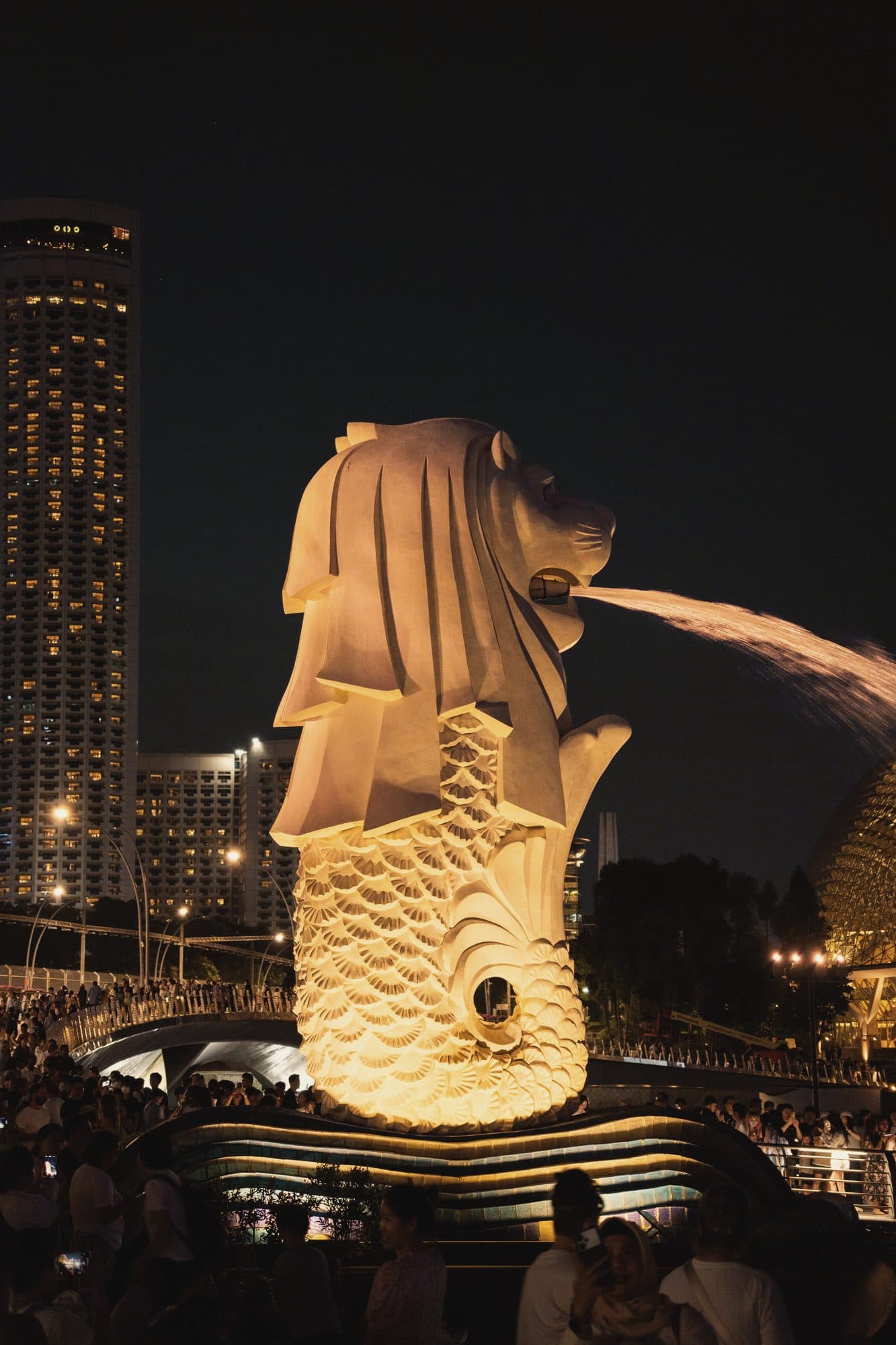 The Merlion lit at night on Marina Bay, Singapore
