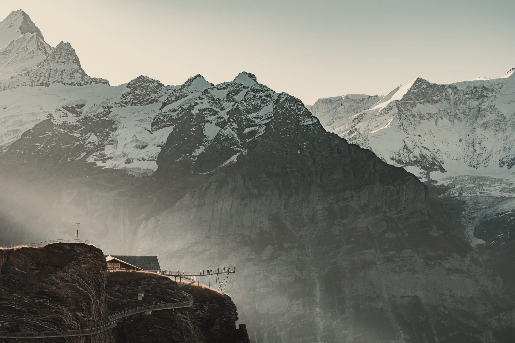 The Grindelwald First cliff walk beneath snow peaks in the Bernese Oberland