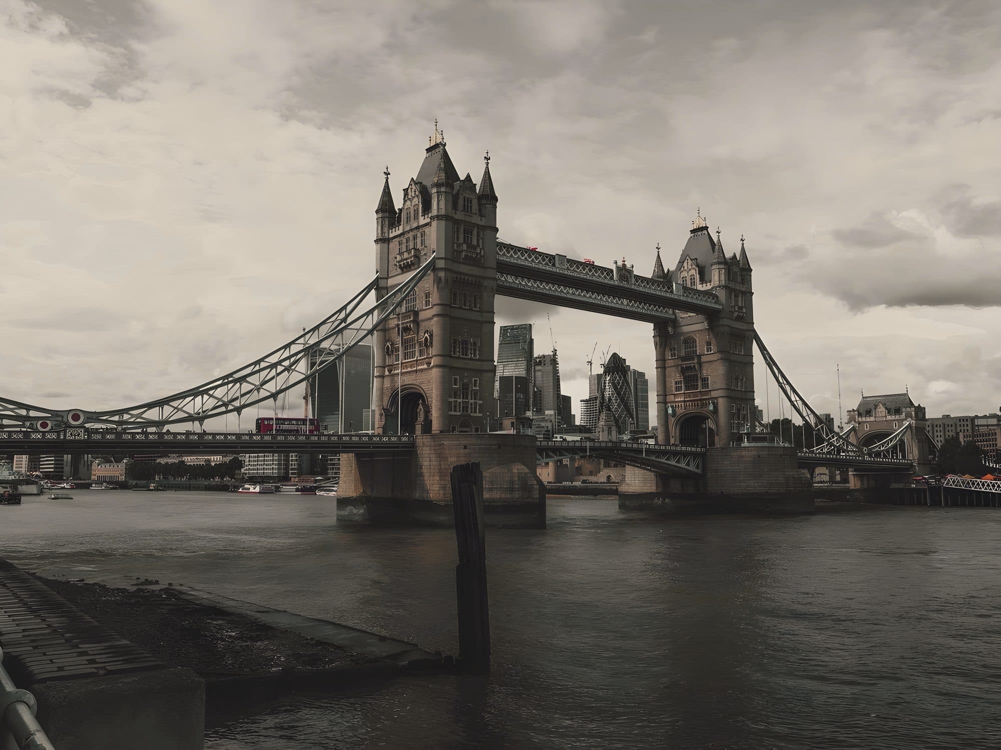 Tower Bridge over the Thames under a soft grey London sky